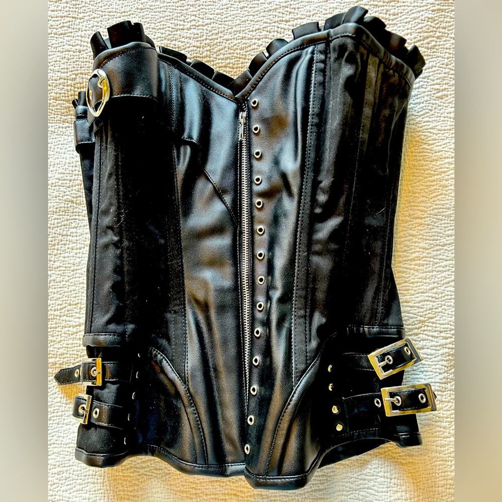 Black leather and satin corset with zipper, laces, buckles and iron ribbing
